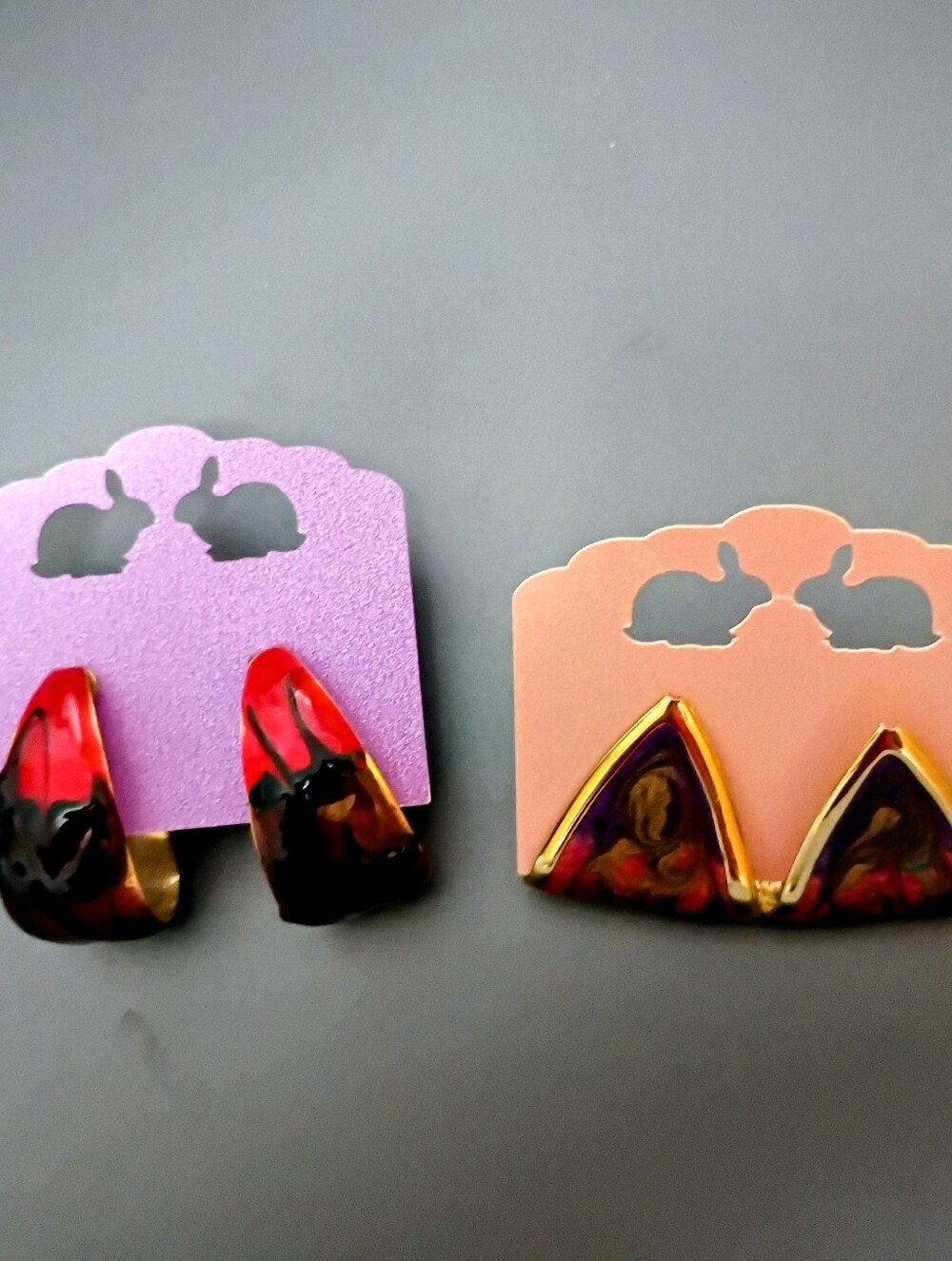 2 Pairs of Gold Toned Pierced Earrings multi colored with reds, black and more!